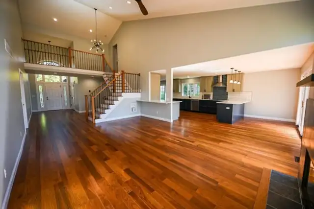 Plymouth Township, MI whole-home renovation with new hardwood floors, oak and metal railings and an open kitchen